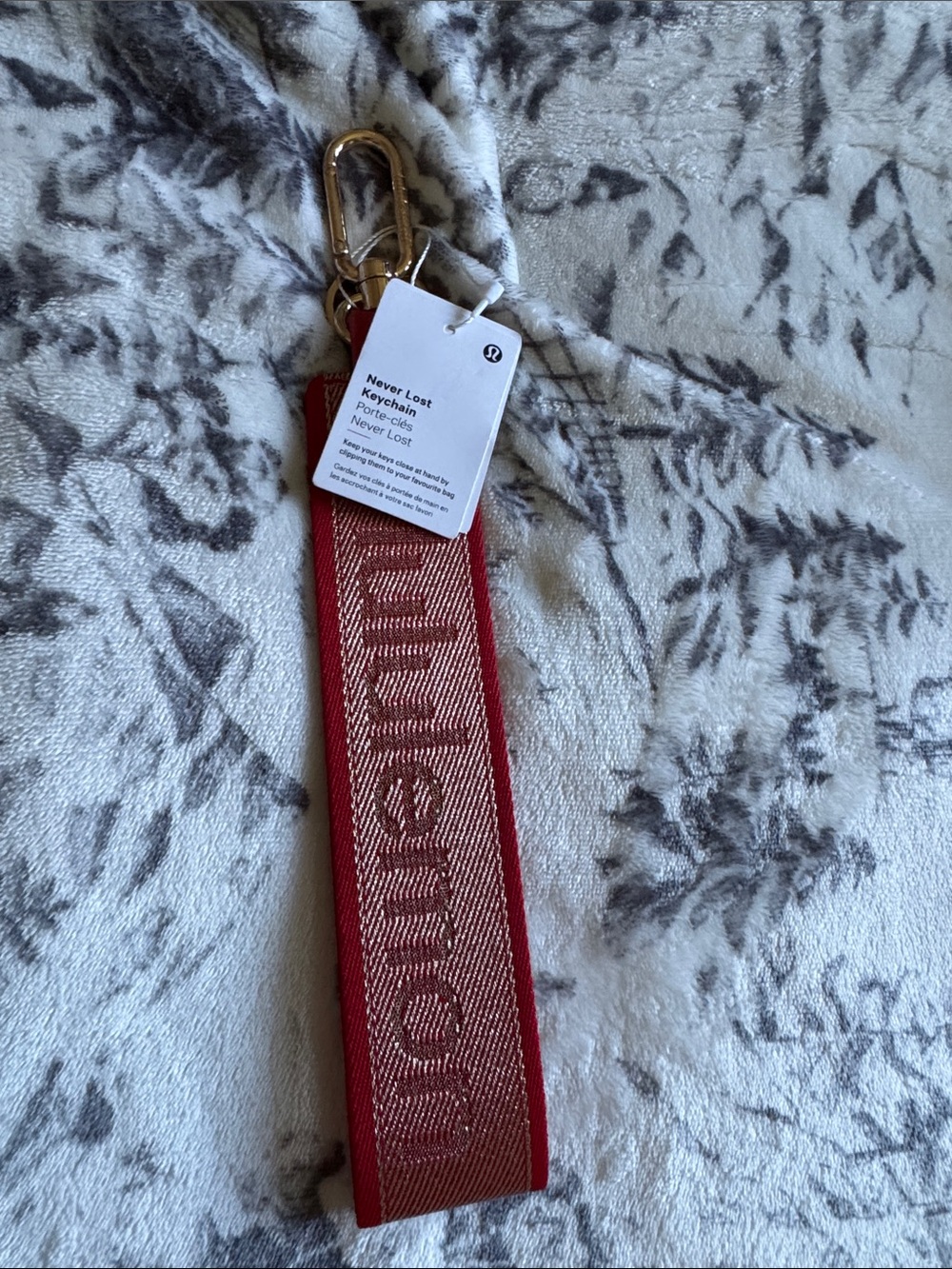 lululemon athletica red jacquard logo key wristlet with gold hardware